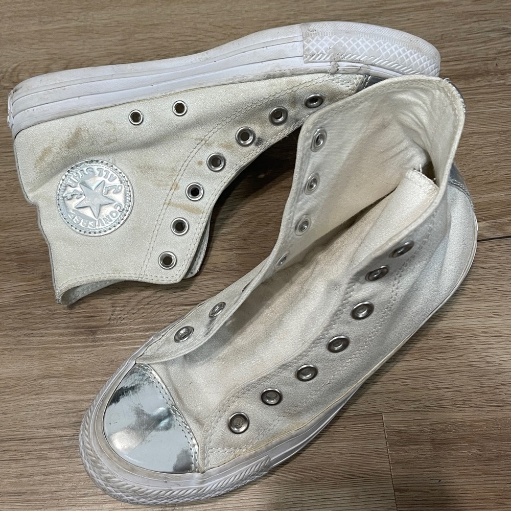 Chuck Taylor Converse high top white and silver lace up sneakers in size 7